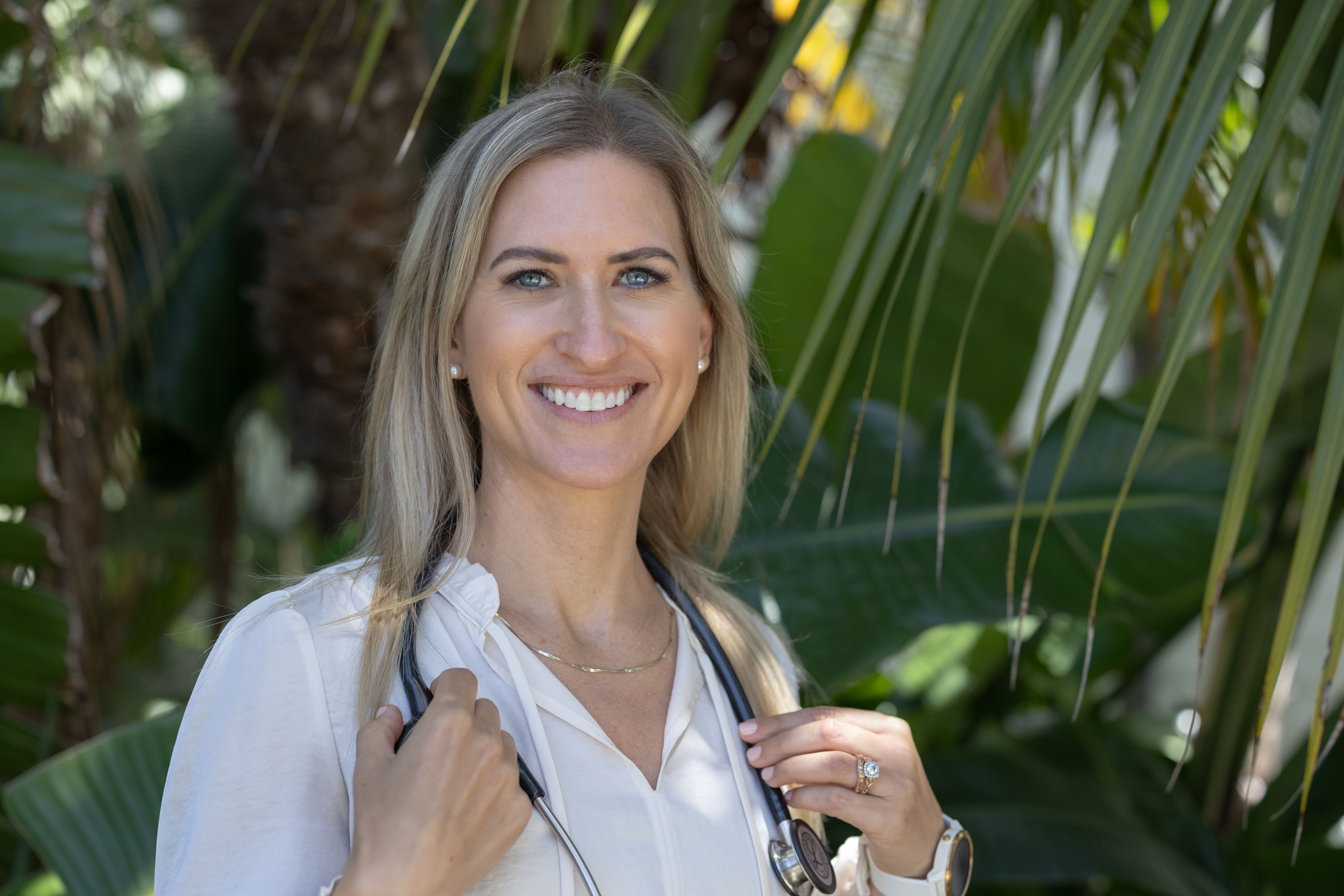 Dr. Maggie Boomgaarden with stethoscope in natural setting